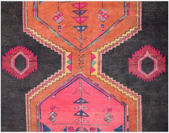 A vintage Persian Hamadan runner featuring geometric patterns in orange, pink, and black wool.
