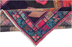 A vintage Persian Hamadan runner featuring geometric patterns in vibrant pink, blue, and black.