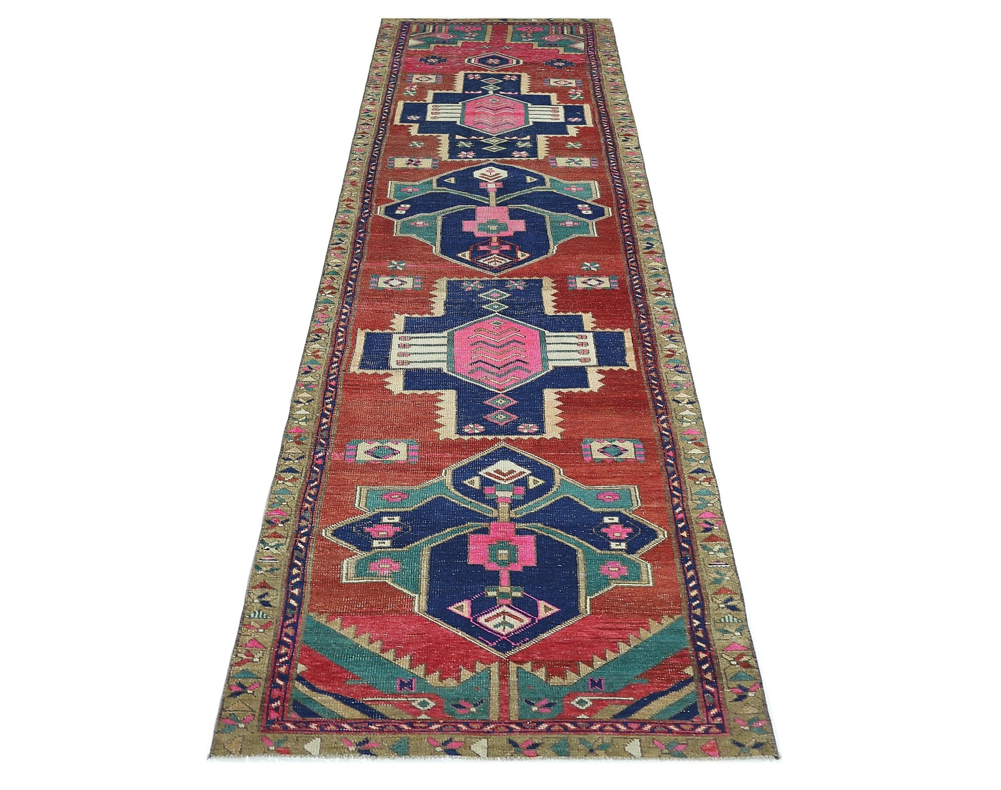 A vintage Persian Hamadan runner featuring geometric motifs in red, blue, and pink wool.