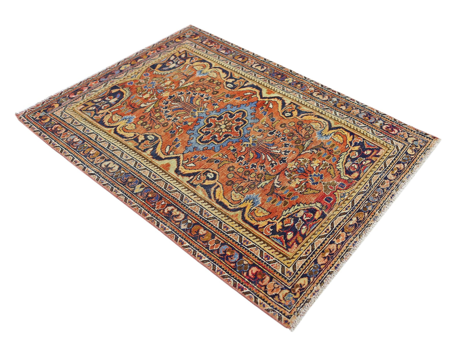 A vintage Persian Heriz rug featuring a central medallion on an orange field with floral patterns.