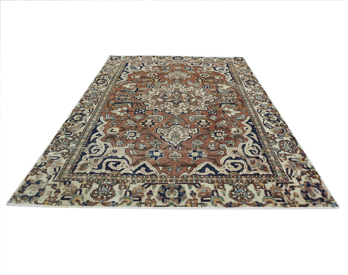 A vintage Persian Heriz rug featuring a traditional geometric medallion pattern in rust and blue.