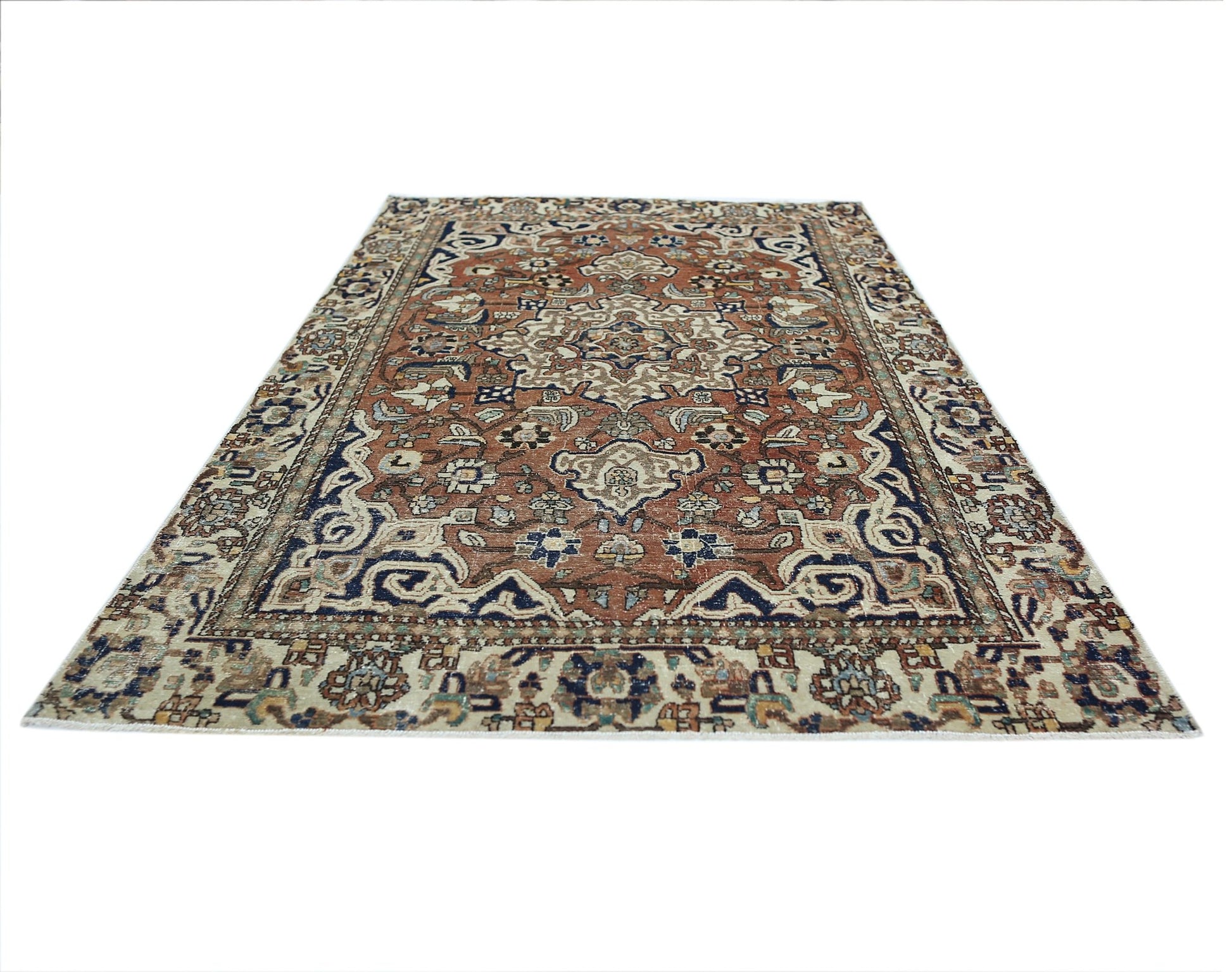 A vintage Persian Heriz rug featuring a traditional geometric medallion pattern in rust and blue.