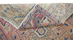 A vintage Persian Heriz runner with a folded corner revealing its wool and cotton construction.