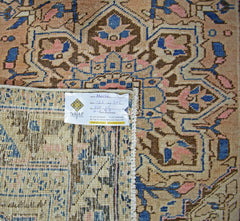 A vintage Persian Heriz runner featuring a geometric floral pattern in blue, pink, and brown.