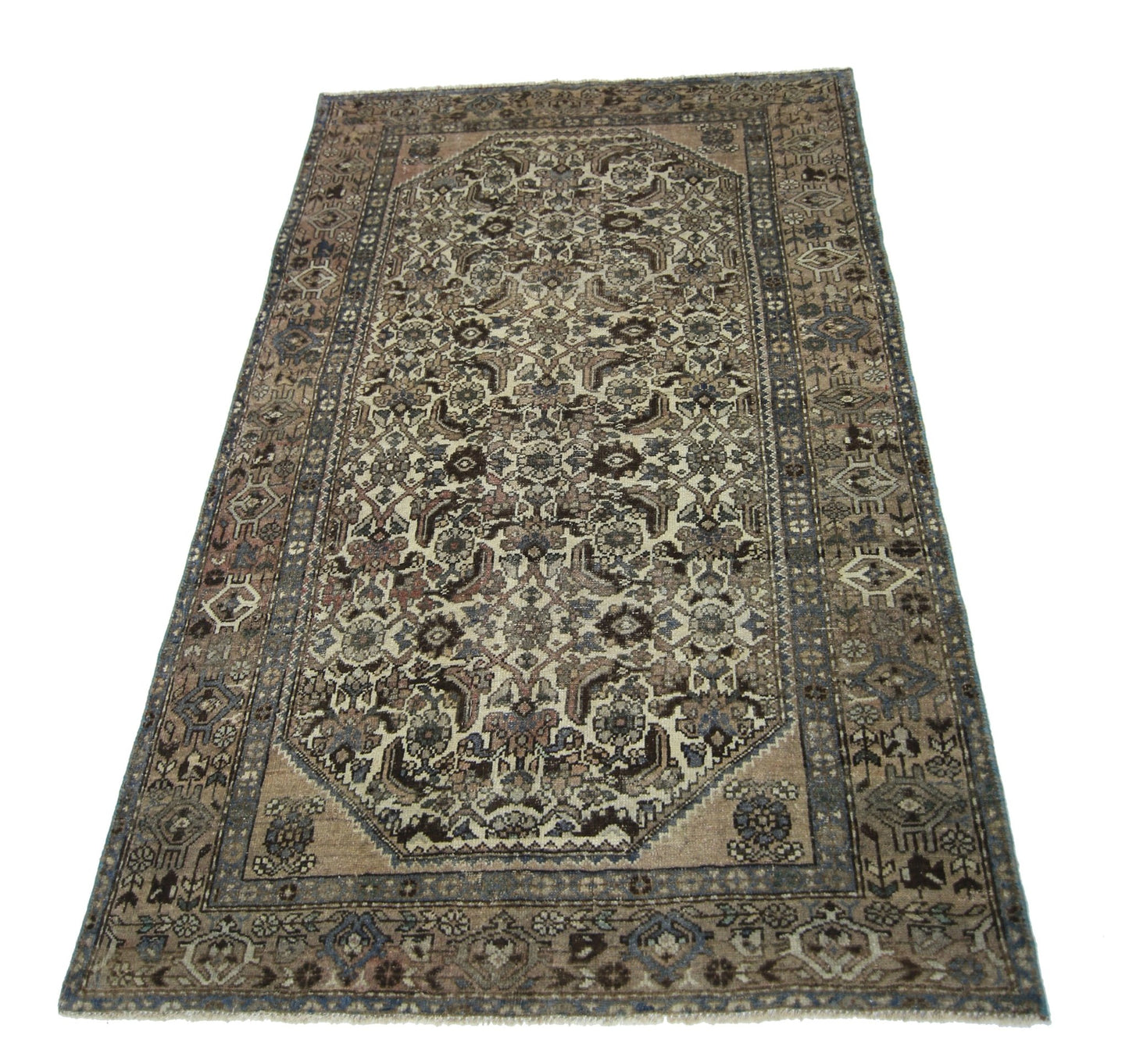 A rectangular vintage Persian rug featuring an intricate floral pattern in muted earth tones.