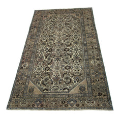 A rectangular vintage Persian rug featuring an intricate floral pattern in muted earth tones.