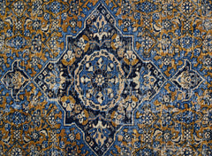 A vintage Persian Hossainabad rug featuring a central medallion in blue, gold, and cream tones.