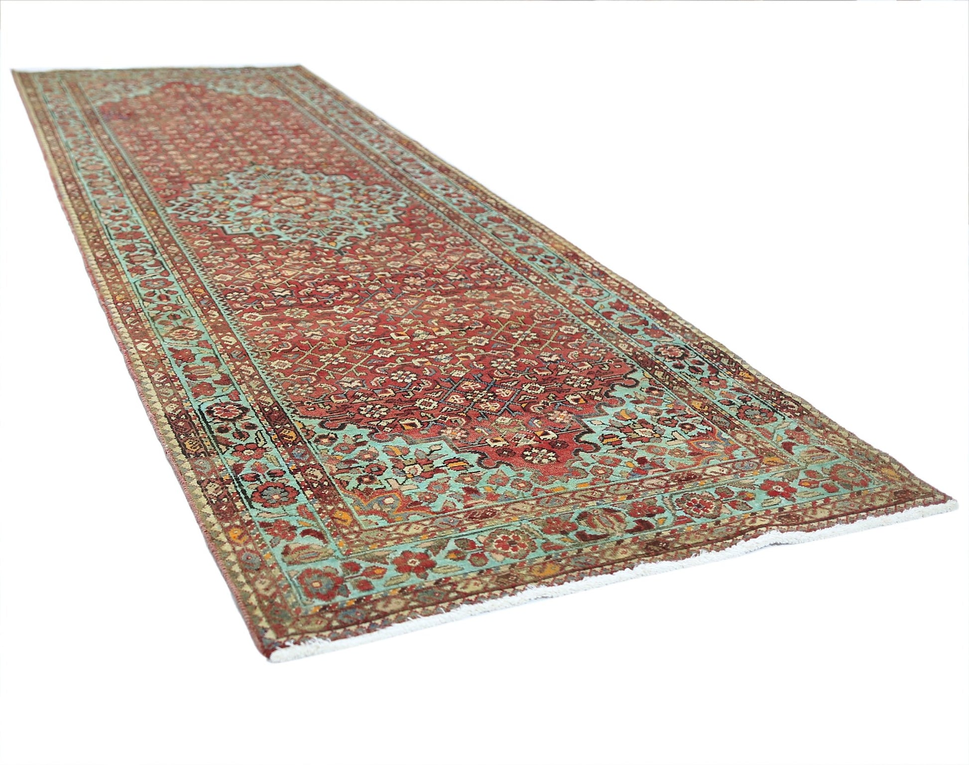A vintage Persian Hossainabad runner rug featuring a red field with intricate floral patterns.