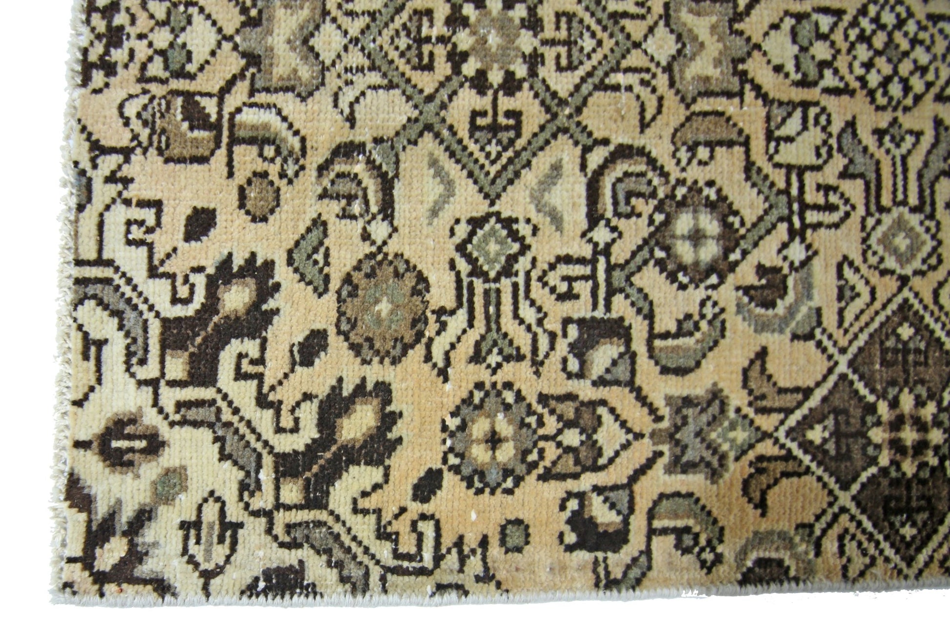 A vintage Persian Hamadan runner featuring intricate geometric patterns in beige and brown tones.