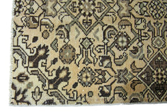 A vintage Persian Hamadan runner featuring intricate geometric patterns in beige and brown tones.