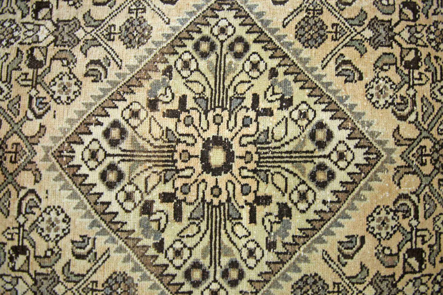 A vintage Persian Hamadan runner featuring a geometric diamond medallion in neutral tones.