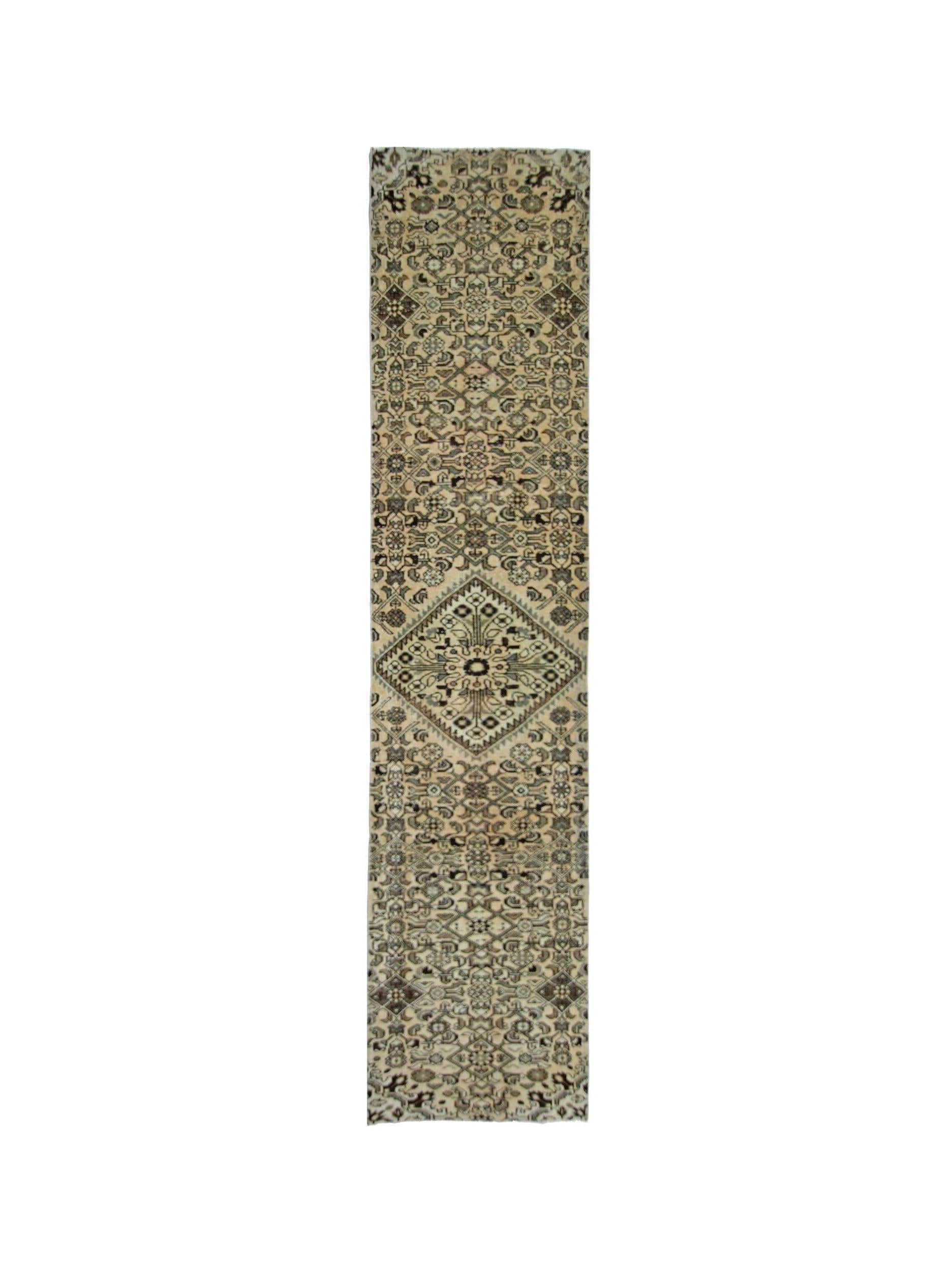 A vintage Persian Hamadan runner rug featuring intricate geometric patterns in neutral tones.
