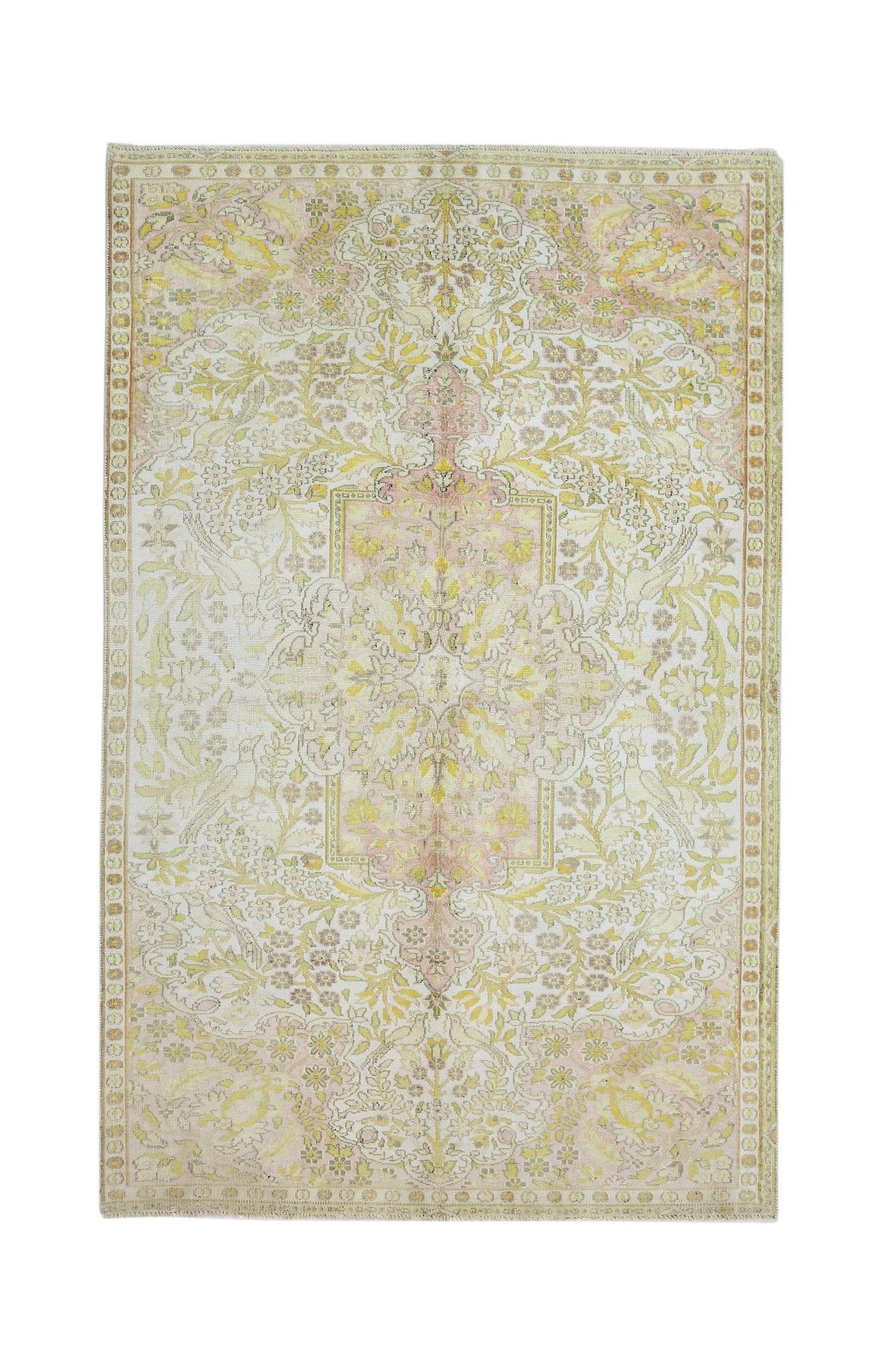 Vintage Persian Kashan rug featuring a floral pattern in soft yellow and pink tones.