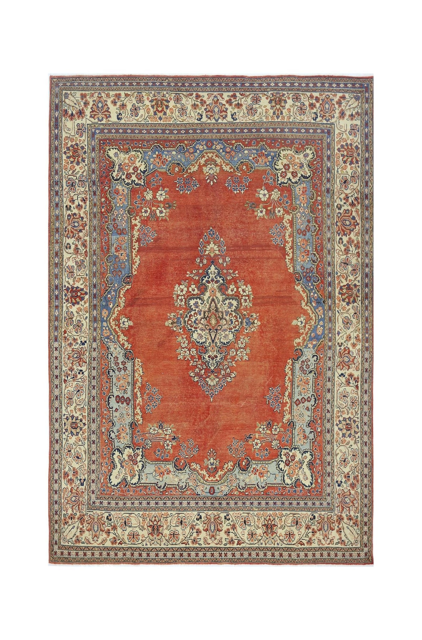 A vintage Persian Tabriz rug featuring a central floral medallion on a red field with blue borders.
