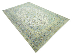 Hand-knotted vintage Persian Kashan rug featuring a soft sage green and cream floral medallion design.