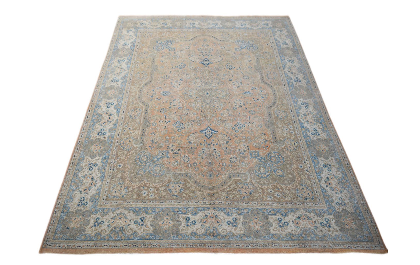 A vintage Persian Kashan rug featuring a central floral medallion in soft peach and blue tones.