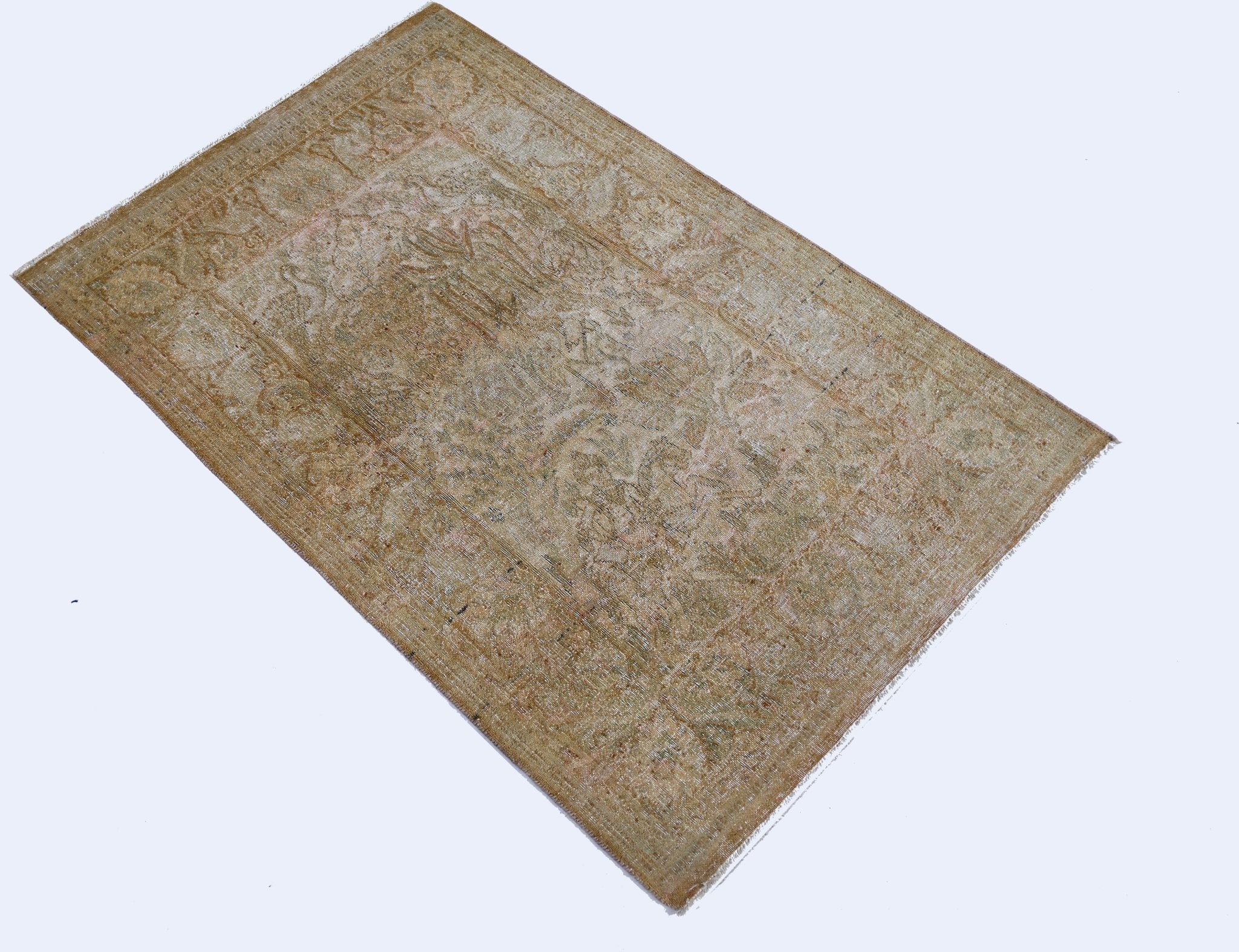 A vintage Persian Kerman rug featuring a faded floral medallion design in soft, neutral tones.