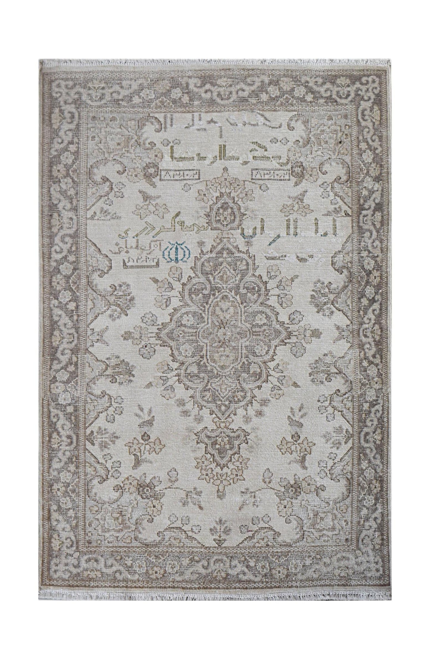 A vintage Persian Kerman rug featuring a central medallion and intricate floral motifs in neutral tones.