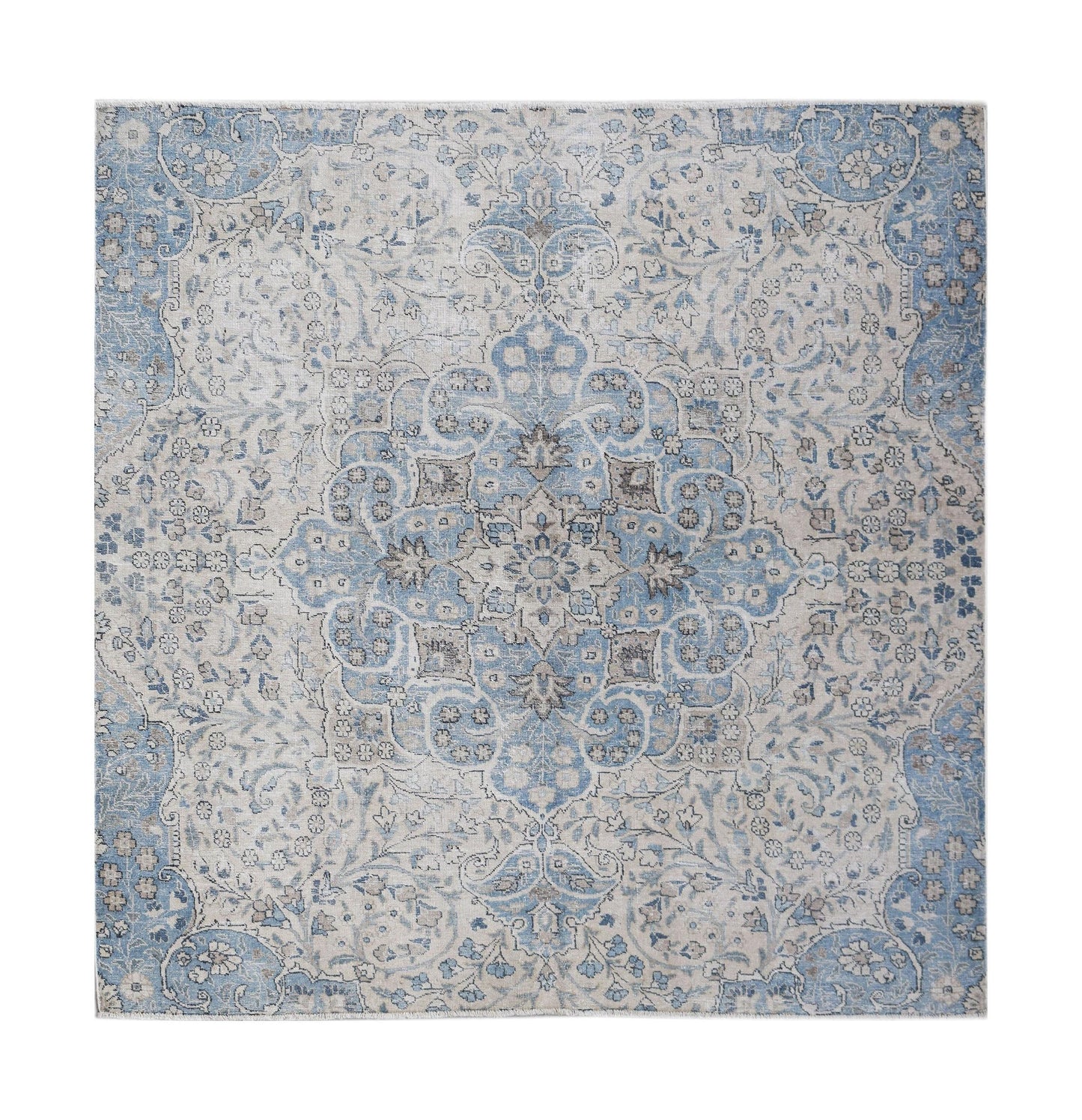 A square vintage Persian Kerman rug featuring a central medallion in shades of blue and grey.