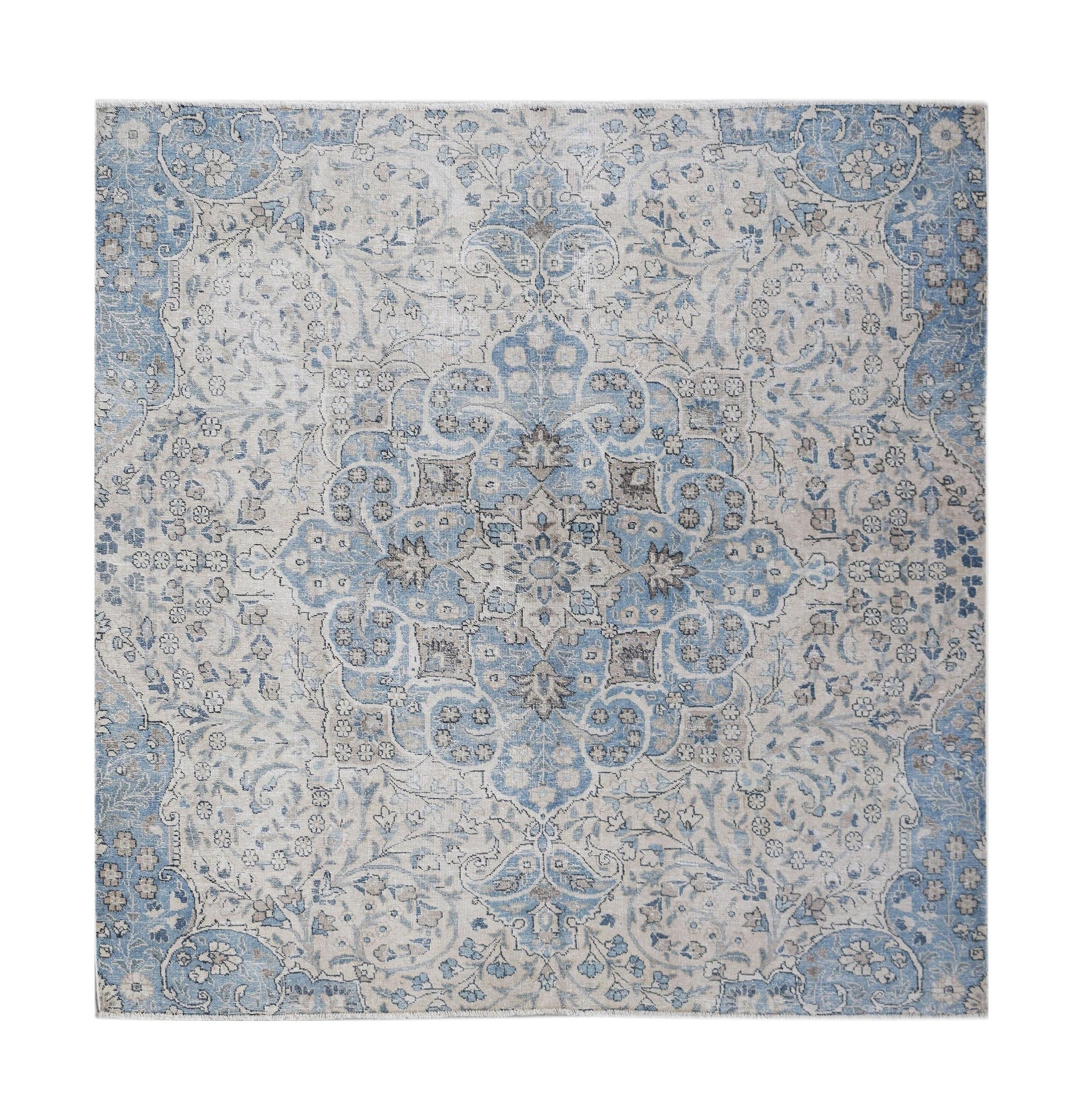 A square vintage Persian Kerman rug featuring a central medallion in shades of blue and grey.