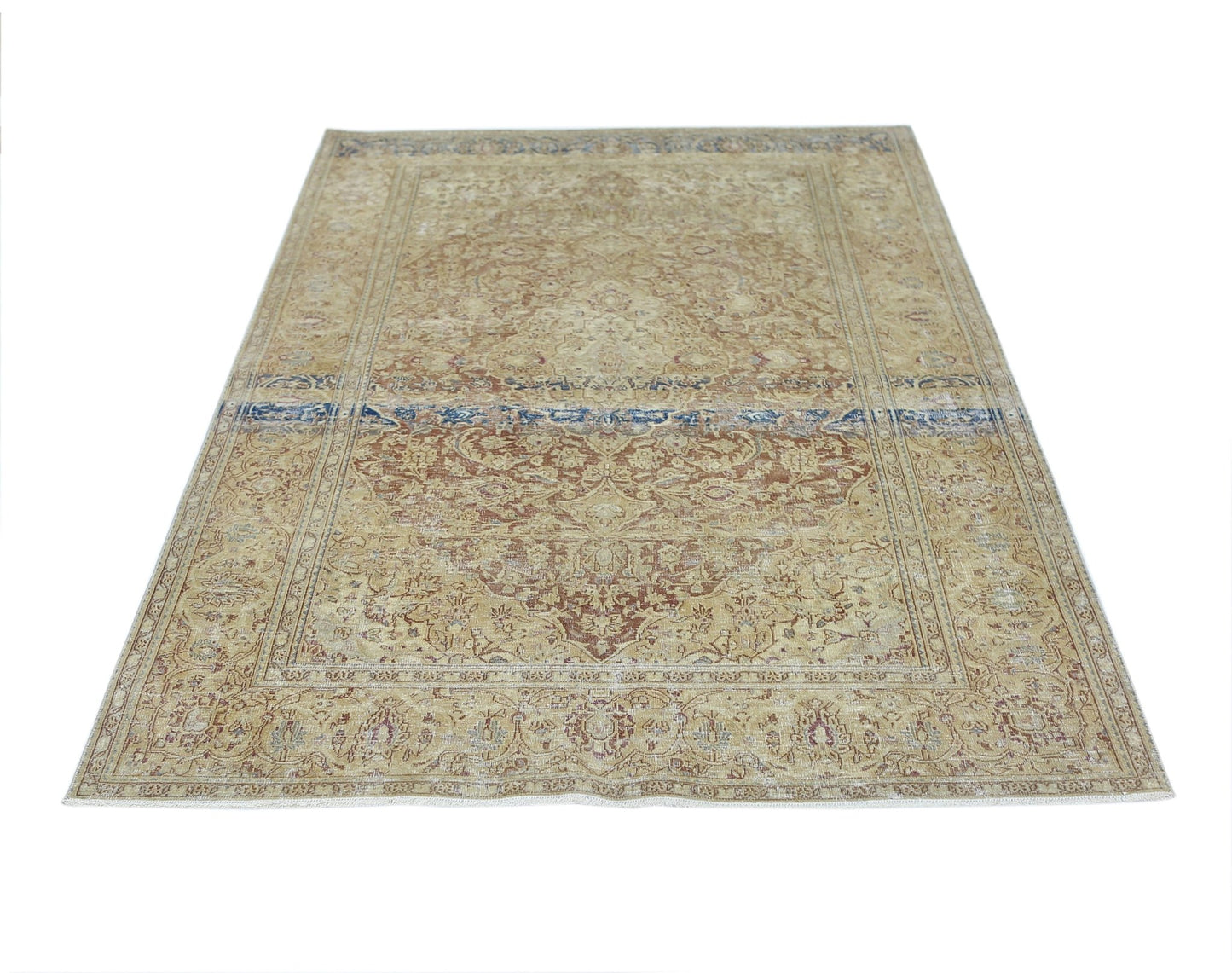 A vintage Persian Kerman rug featuring a central medallion and intricate floral patterns in tan.
