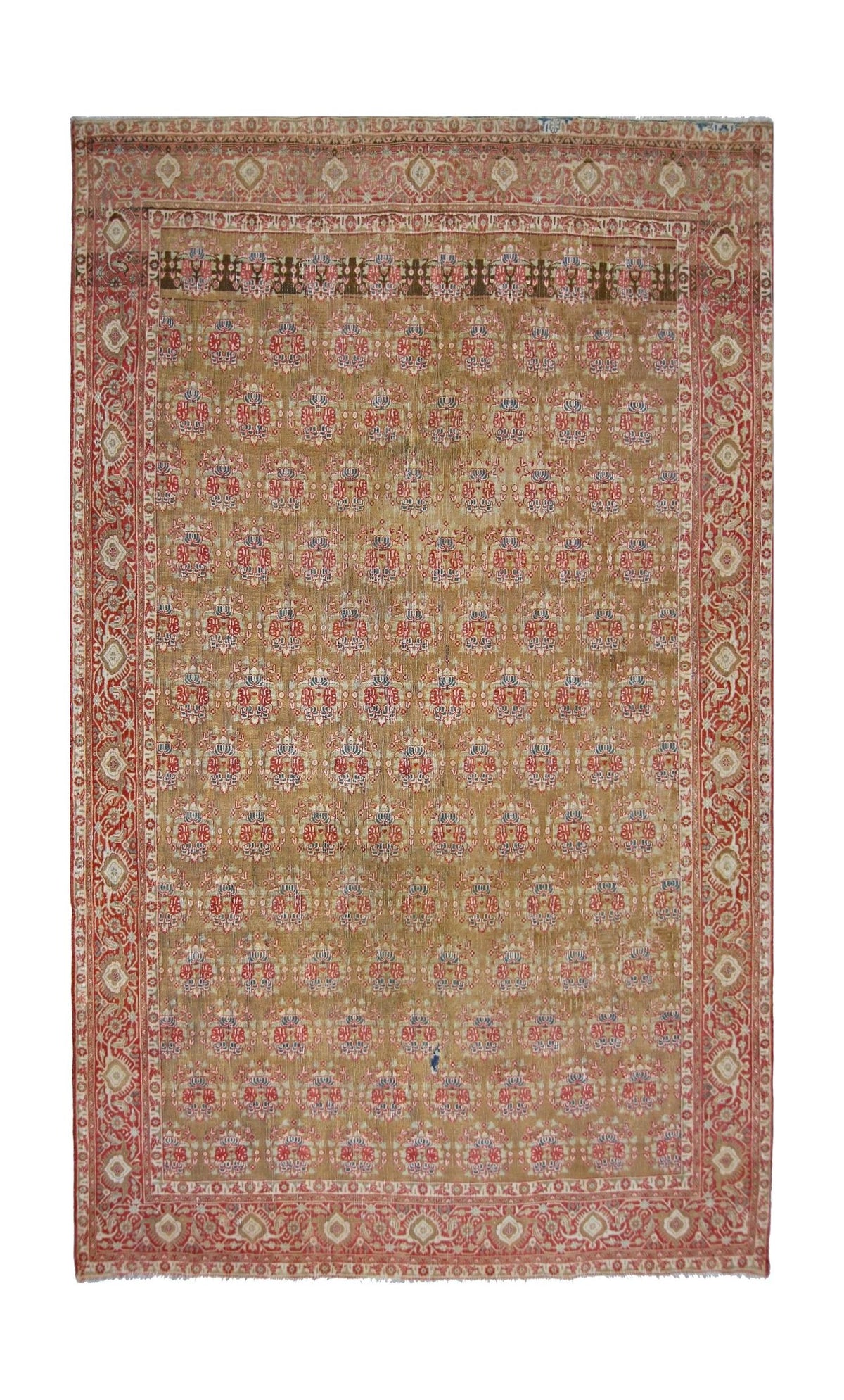Vintage Kerman rug with a gold field, intricate red floral motifs, and a wide decorative border on a cotton foundation.