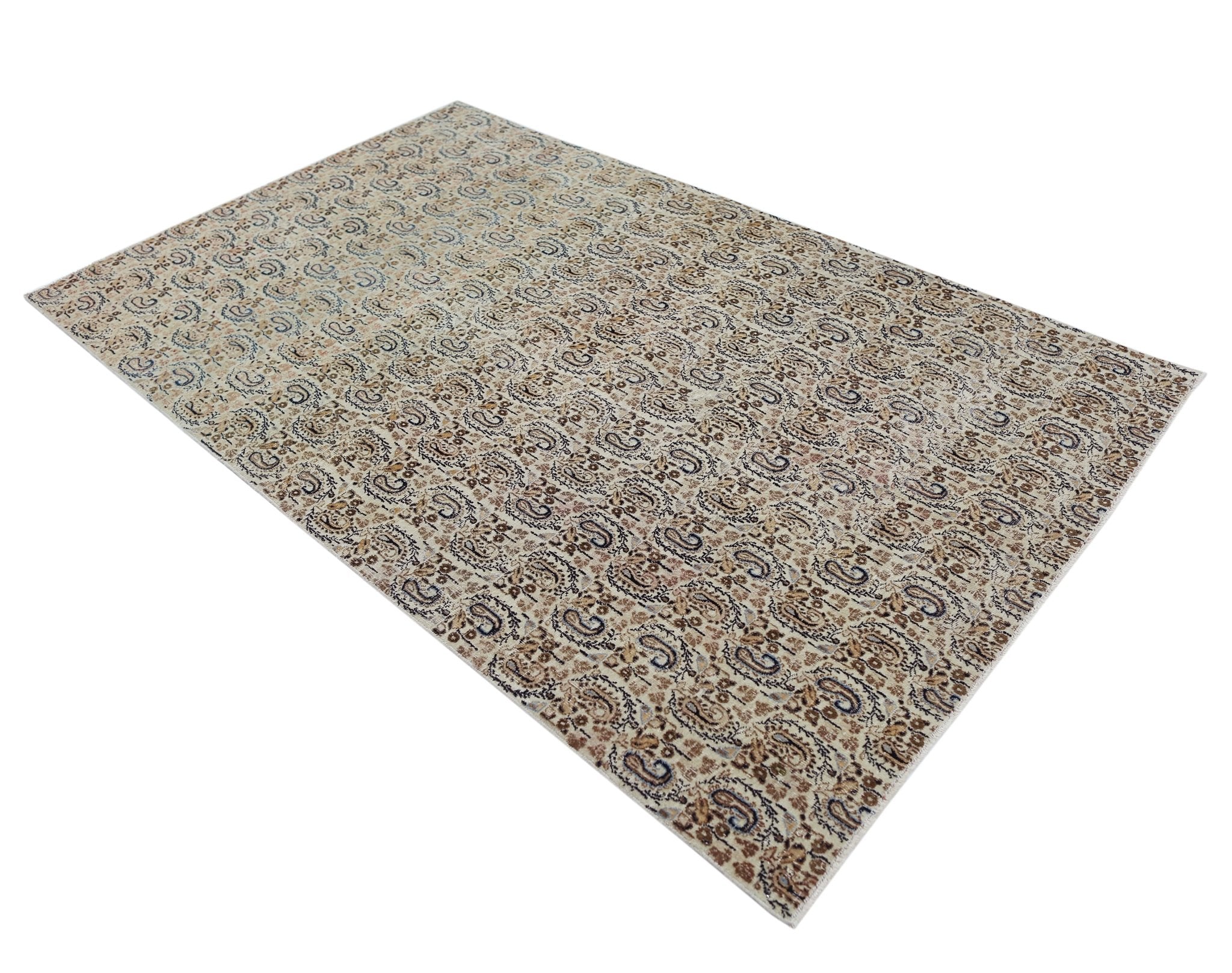 A rectangular vintage Turkish rug featuring an all-over intricate paisley pattern in neutral tones.