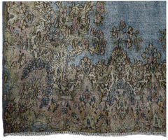A vintage Persian Kerman rug featuring intricate floral patterns in soft blue and muted tones.