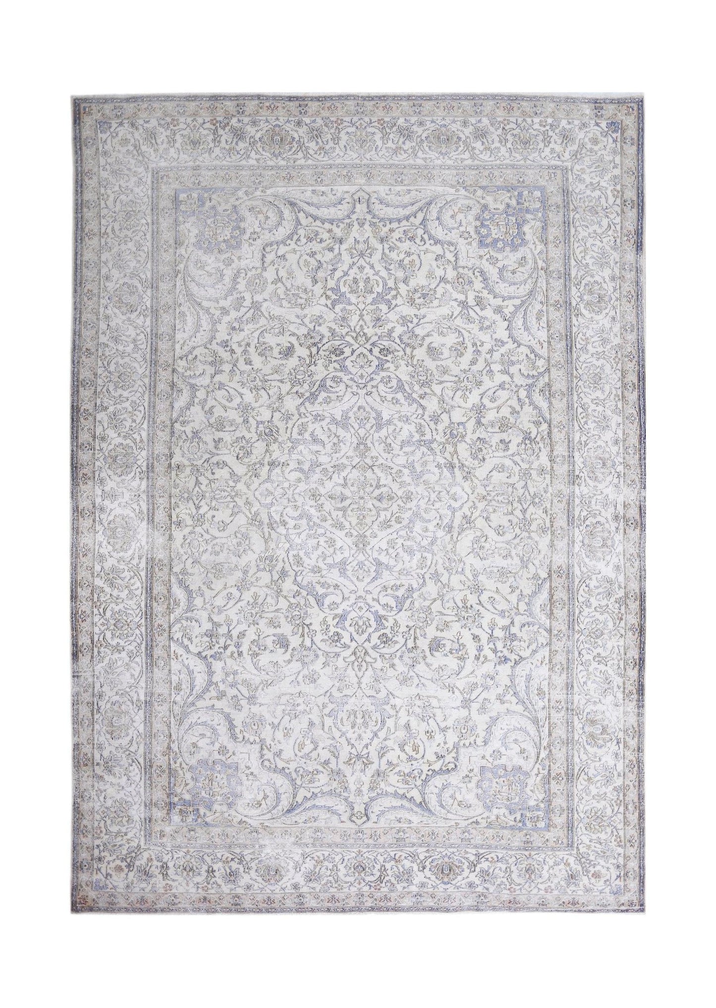 A vintage Persian Kerman rug featuring an intricate floral medallion design in soft blue and cream.