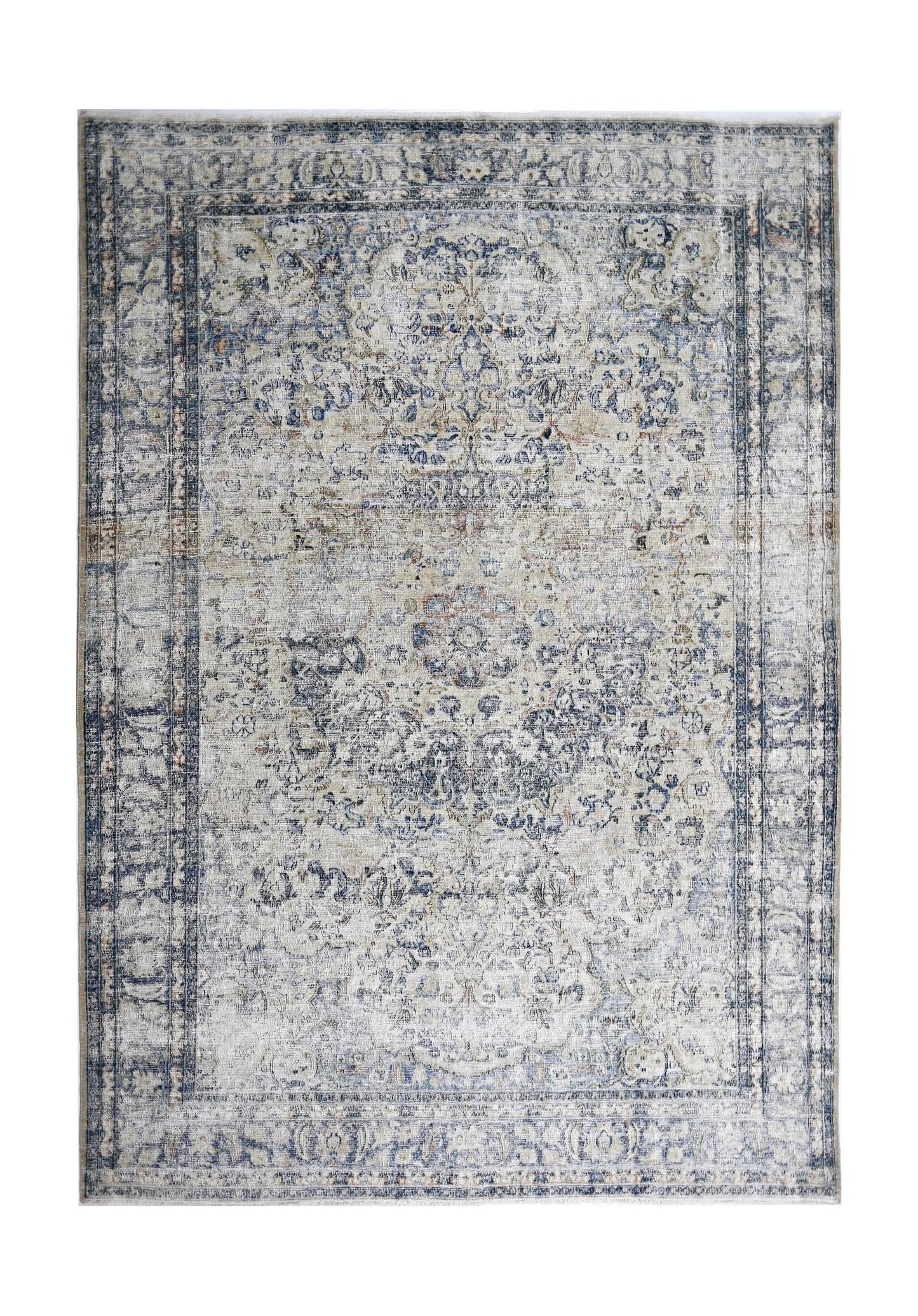 A vintage Persian Kerman rug featuring a central medallion and intricate floral patterns in blue.