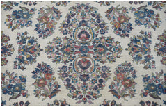 A vintage Persian Kerman rug featuring an intricate floral medallion design on a cream background.