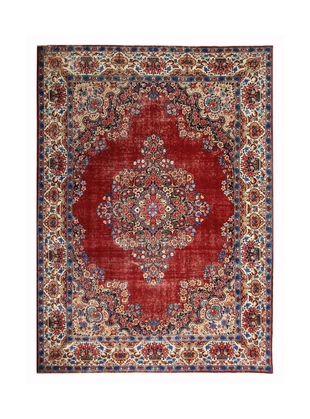 Vintage Persian Kerman rug featuring a central floral medallion, intricate curvilinear patterns, and red field.