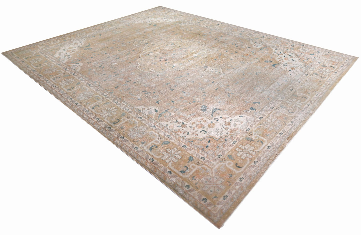 A vintage Persian Kerman rug featuring a central medallion and intricate floral patterns.