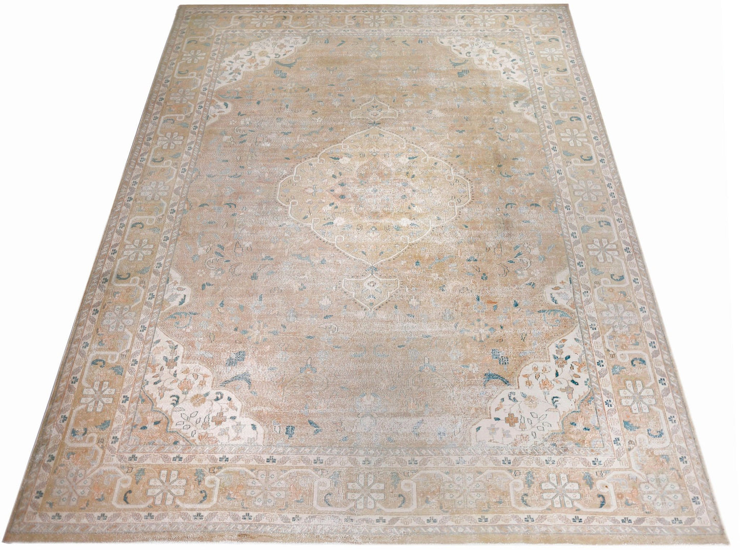 A vintage Persian Kerman rug featuring a central medallion and intricate floral patterns in beige.