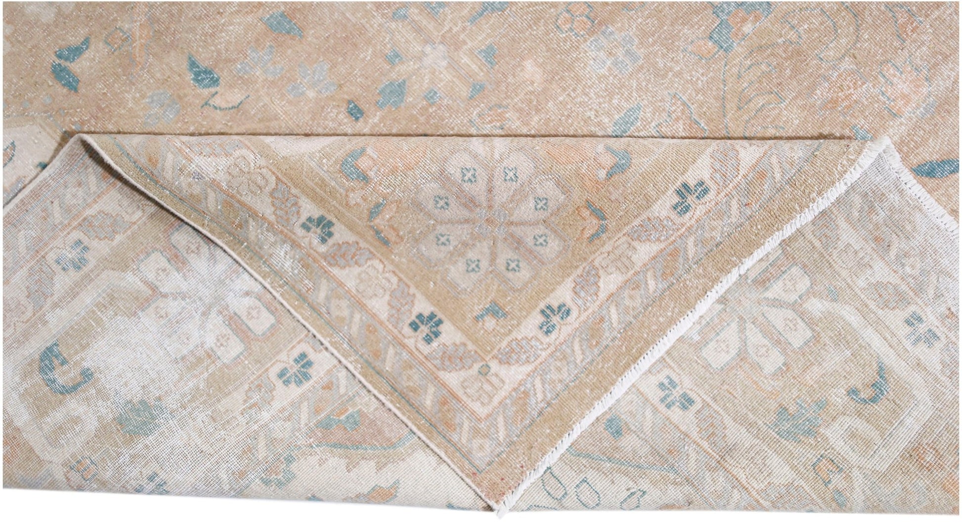A vintage Persian Kerman rug featuring a soft beige palette with intricate floral medallion motifs.