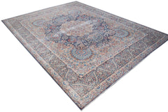 A vintage Persian Kerman rug featuring an intricate floral medallion design in muted blue tones.
