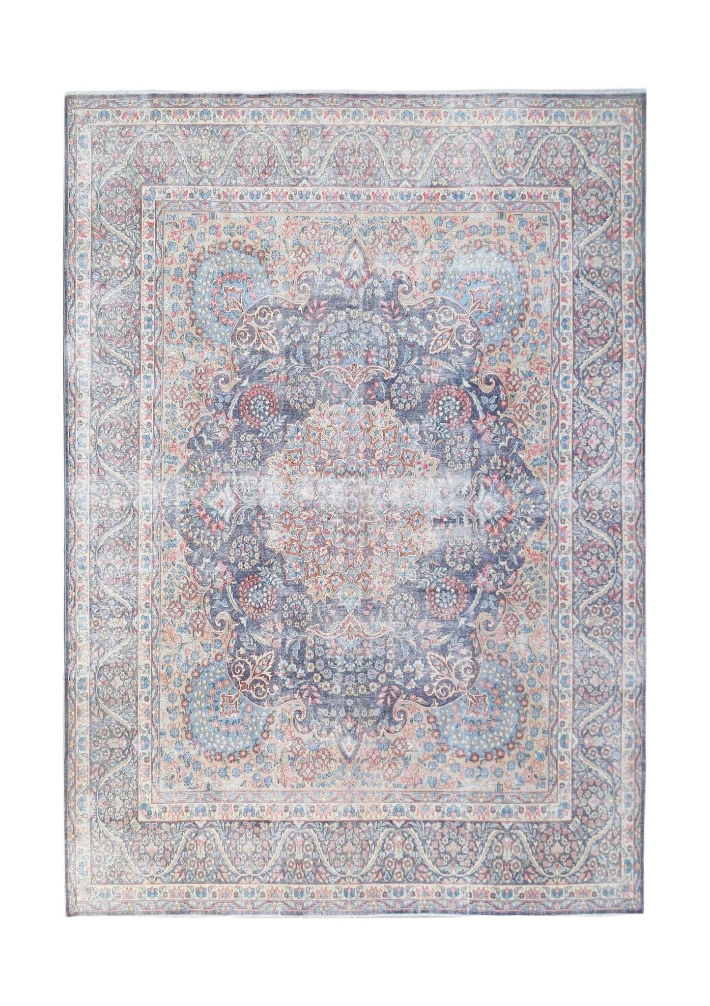 A vintage Persian Kerman rug featuring a central medallion and intricate floral patterns in blue.