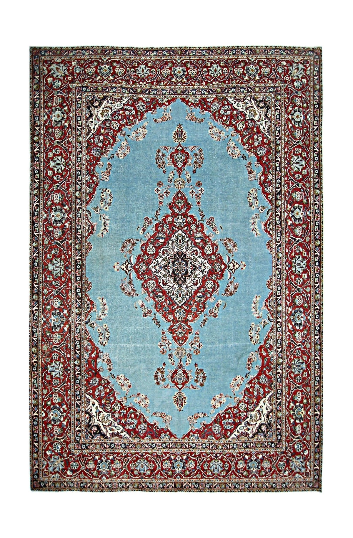 Hand-knotted vintage Kerman rug with a light blue field, intricate red floral medallion, and ornate crimson borders.