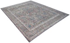 A vintage Persian Kerman rug featuring an intricate floral pattern in soft, muted tones.
