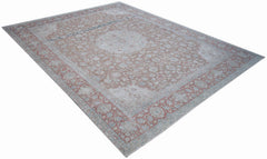 A vintage Persian Kerman rug featuring a central medallion and intricate floral patterns.