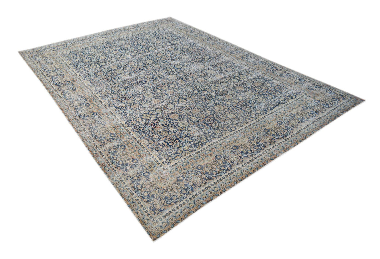 A vintage Persian Kerman rug featuring an intricate floral medallion design in blue and beige.