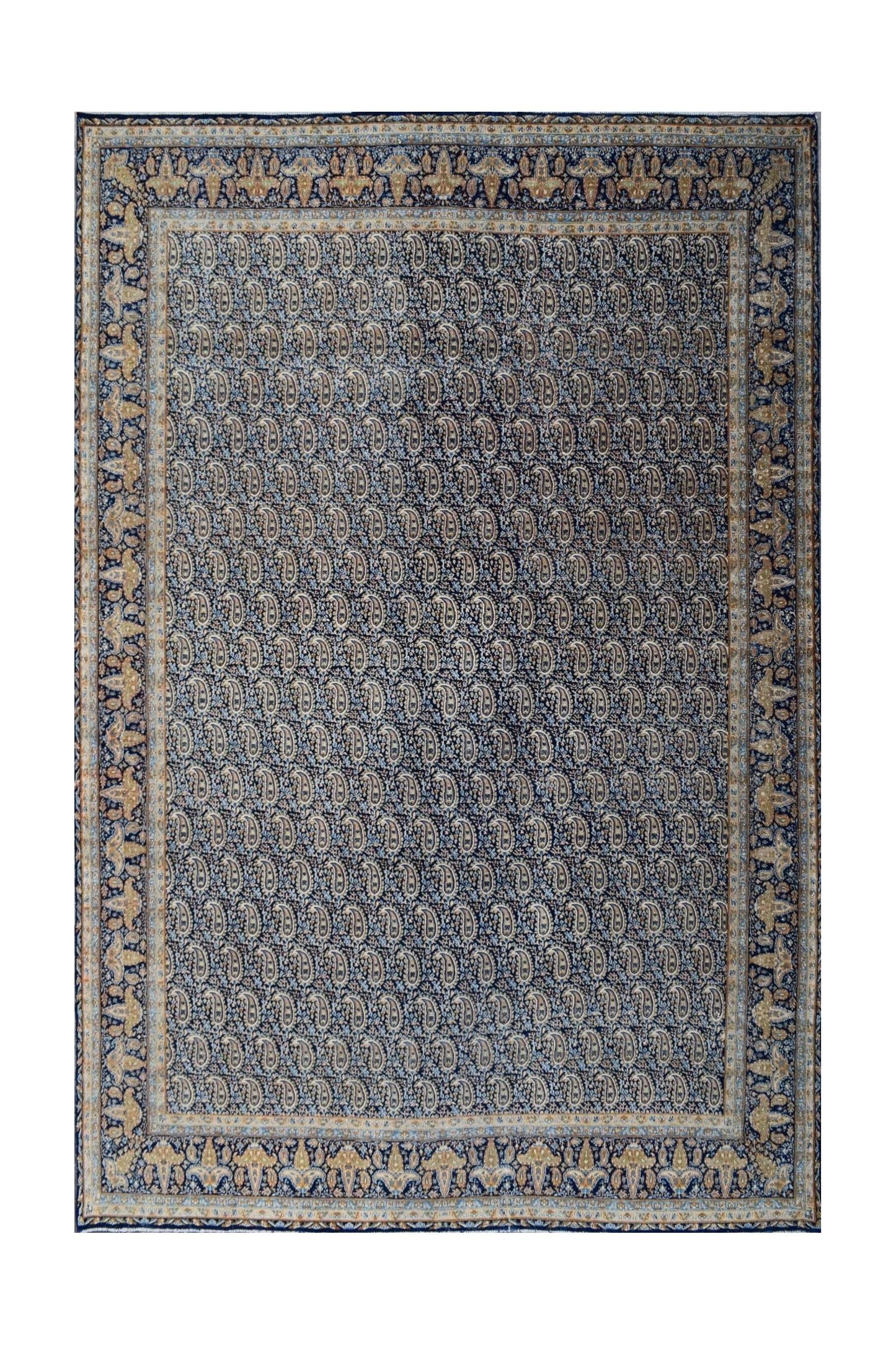 A vintage Persian Kerman rug featuring an intricate all-over paisley pattern in blue and gold.