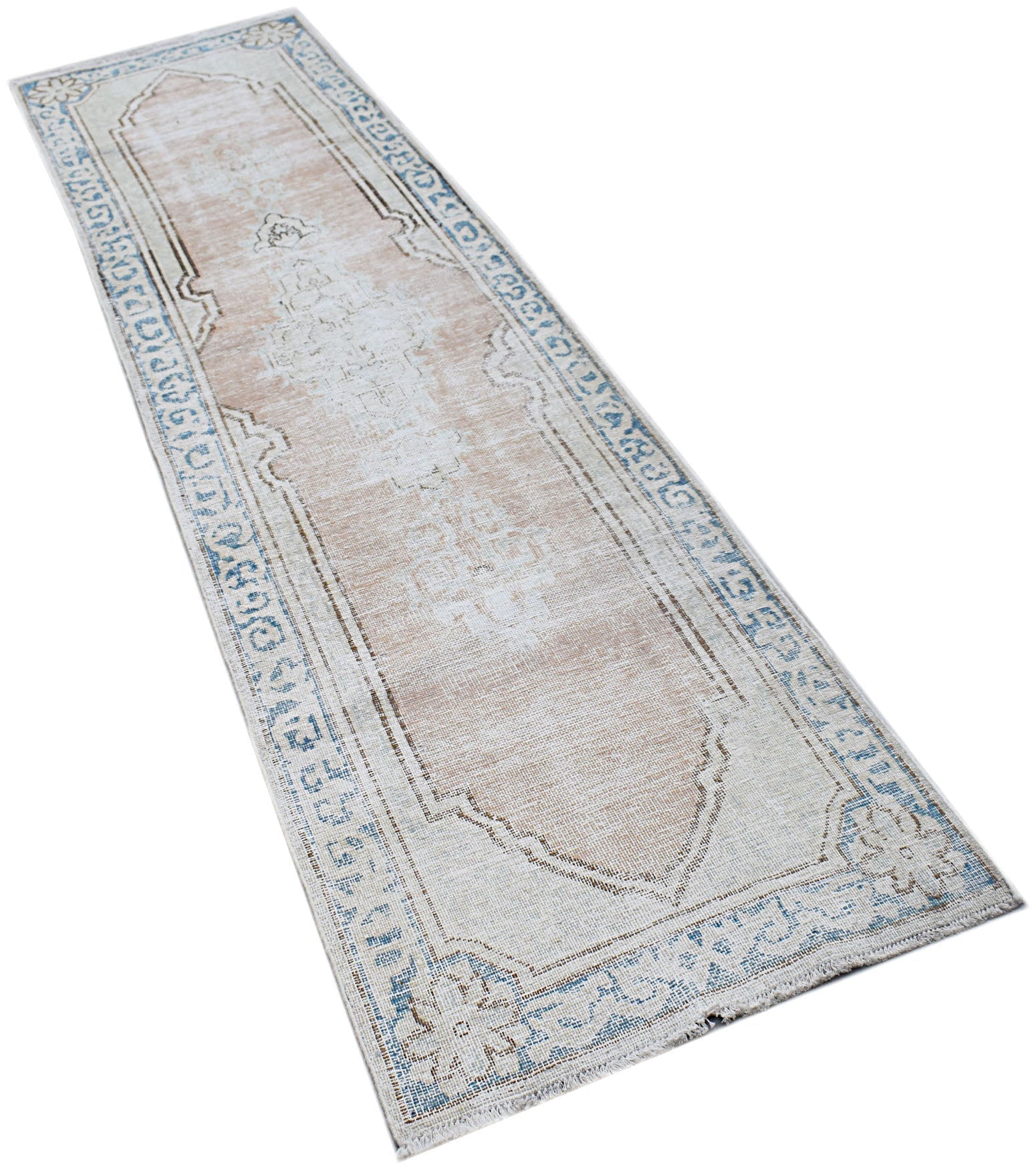 A vintage Persian Kerman runner featuring a central medallion and floral border in muted tones.