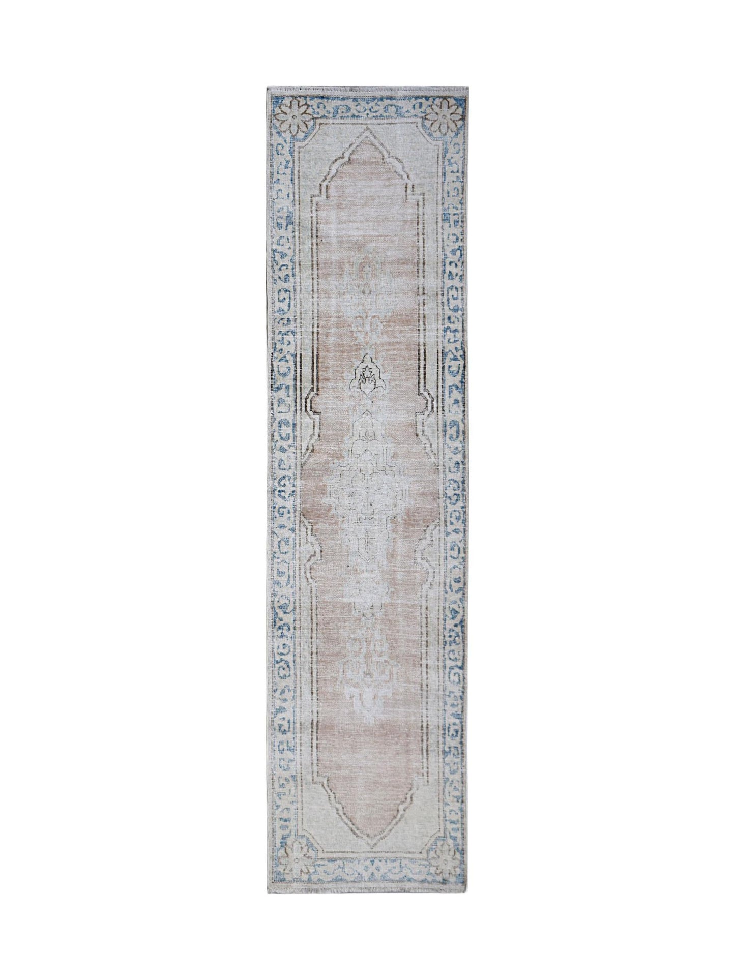 A vintage Persian Kerman runner rug featuring a central medallion and floral border in soft tones.