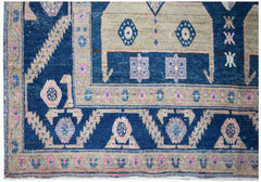A handwoven vintage Persian Koliai rug featuring geometric patterns in blue, pink, and beige.