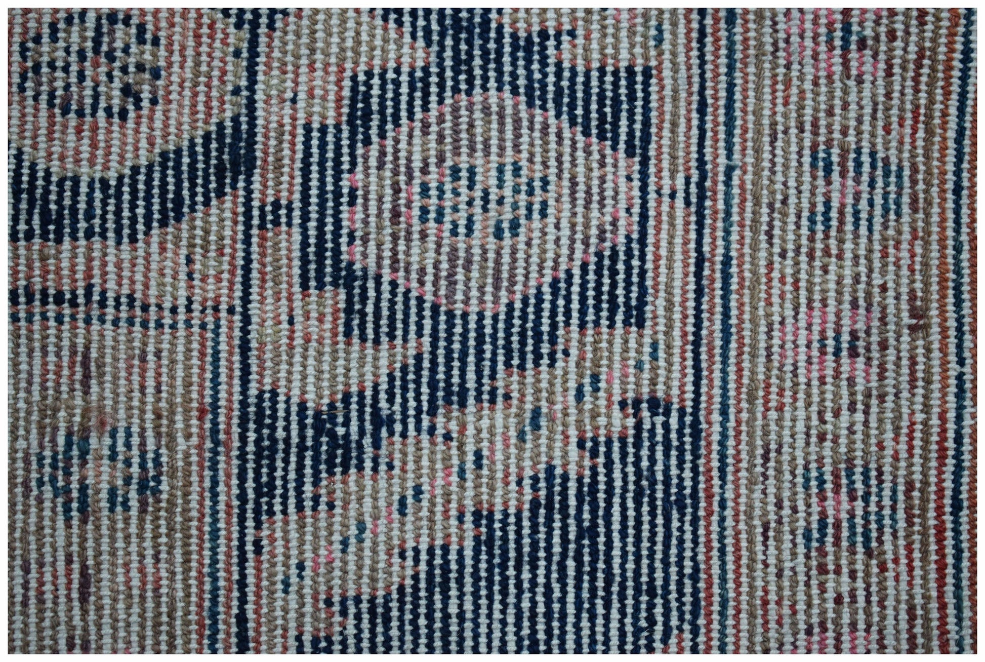 A close-up view of a vintage Persian Koliai rug featuring intricate geometric patterns in wool.