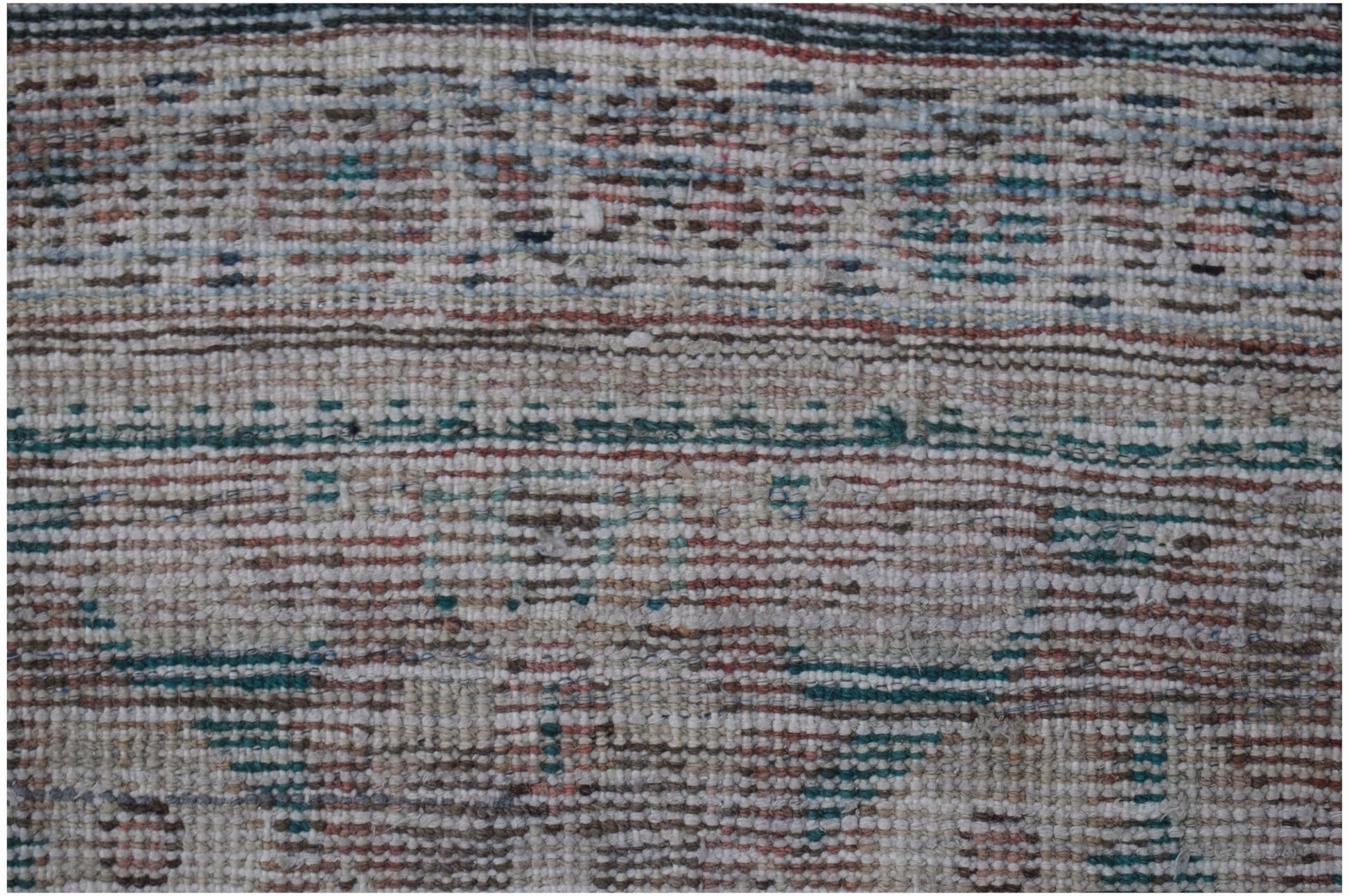 A handwoven vintage Persian Mahal rug featuring a faded geometric pattern in muted earth tones.