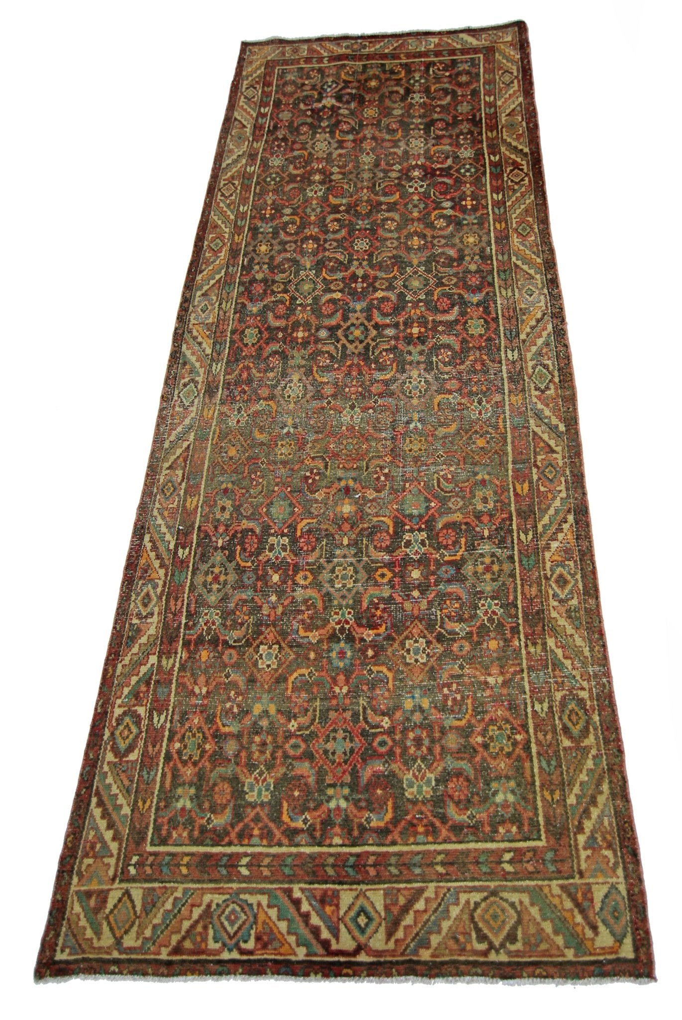 A vintage handmade Persian Hamadan runner featuring a detailed floral pattern in earthy tones.