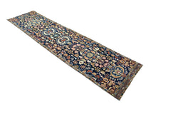 Vintage Persian Malayer runner with intricate floral and geometric motifs in indigo, rust red, and sage on a wool pile.