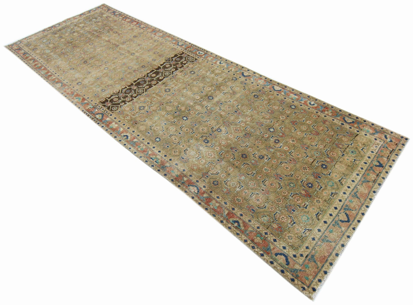 A vintage Persian Hamadan runner featuring a faded tan field with intricate floral patterns.